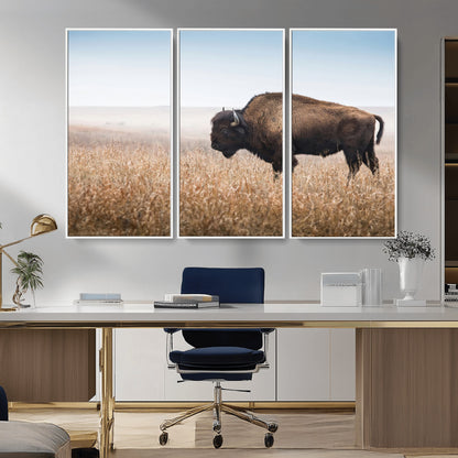 A majestic bison standing in an open prairie field, its strong form blending into the golden grass under a vast blue sky, evoking the wild spirit of the American plains.