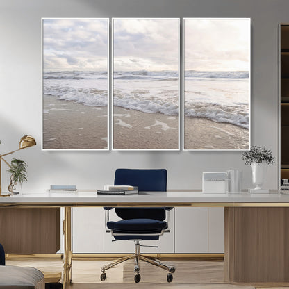 Peaceful ocean waves rolling onto the sandy shore under soft light, perfect for neutral or coastal minimalist decor themes.