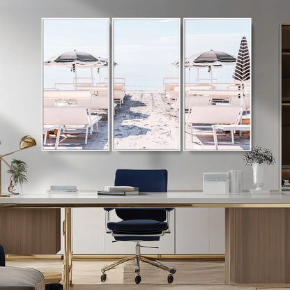 A serene minimalist beach scene featuring striped umbrellas, soft pastel sand, and an elegant lounge setup, creating a tranquil and stylish coastal retreat.