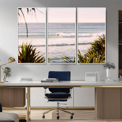 Canvas of a lone surfer riding a pastel wave at sunrise, perfect for tropical or coastal-themed spaces with a relaxed, airy vibe.