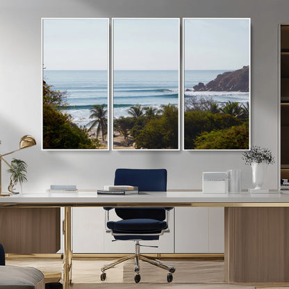 View of calm ocean waves with palm trees and a tropical coastline, ideal for coastal boho or beach-themed wall decor.