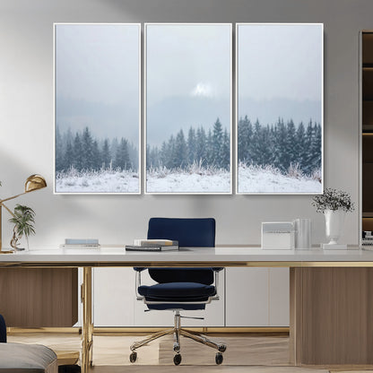 Snow-covered forest under misty sky, soft light breaking through clouds, ideal for minimalist or Nordic-inspired home decor.