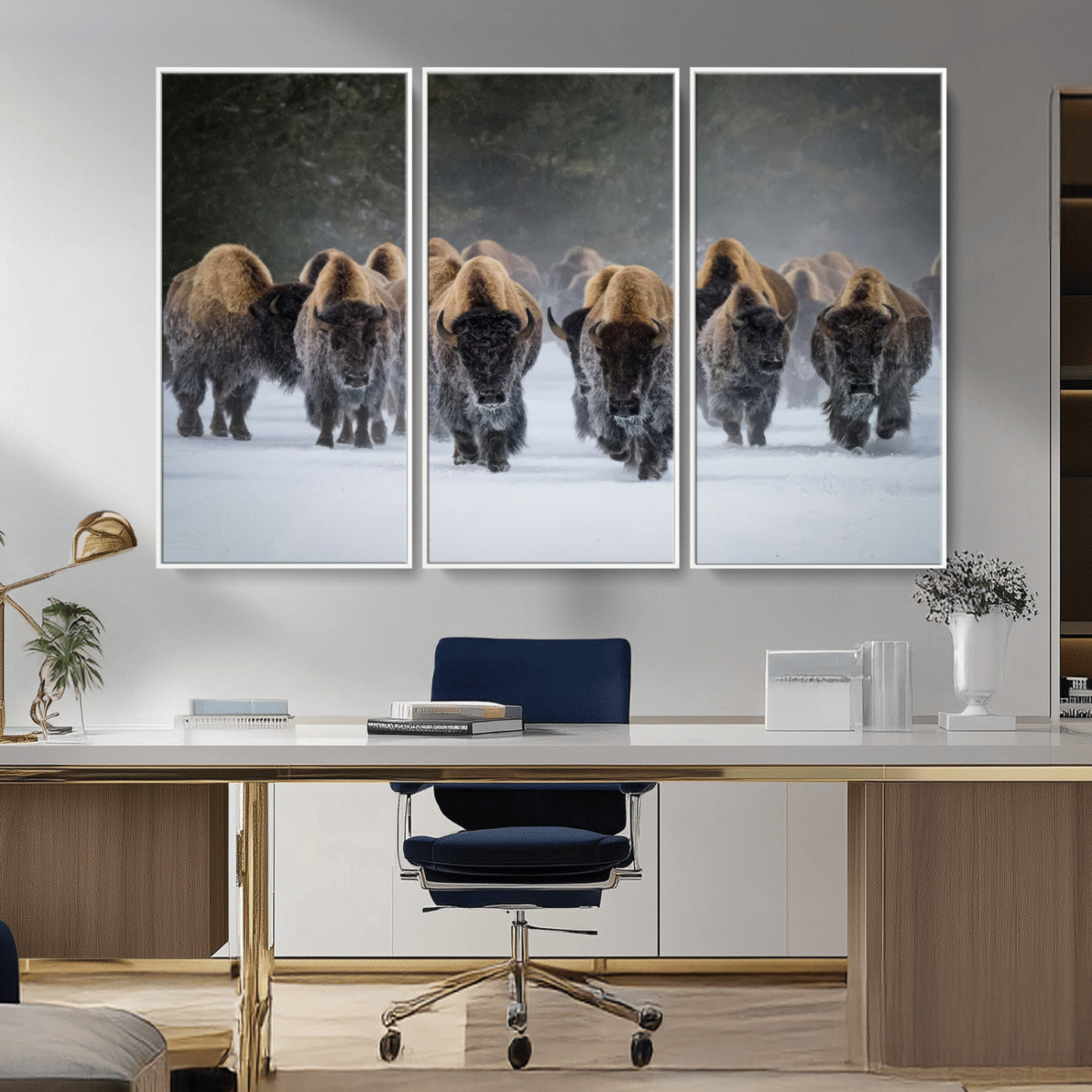 A herd of American bisons walking through deep snow in a forest, evoking a powerful rustic wilderness mood for western-style interiors.