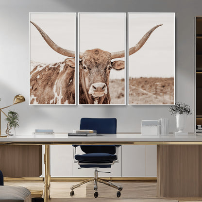 A longhorn cow in soft beige desert tones, standing calmly in open land, perfect for neutral western or rustic farmhouse interiors.