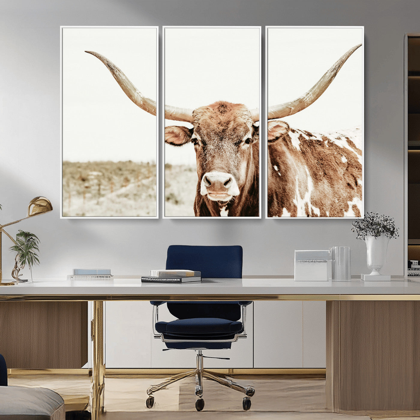 A Texas longhorn bull with wide horns, standing in a dry field under soft light, ideal for rustic farmhouse or western-themed interiors.