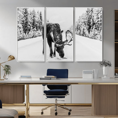 A majestic moose grazing in the snow-covered wilderness, surrounded by snow-covered trees, creating a peaceful winter scene.
