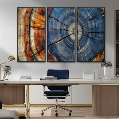 A stunning close-up view of a tree trunk, showcasing the intricate growth rings in a vibrant mix of warm browns, cool blues, and hints of natural texture.