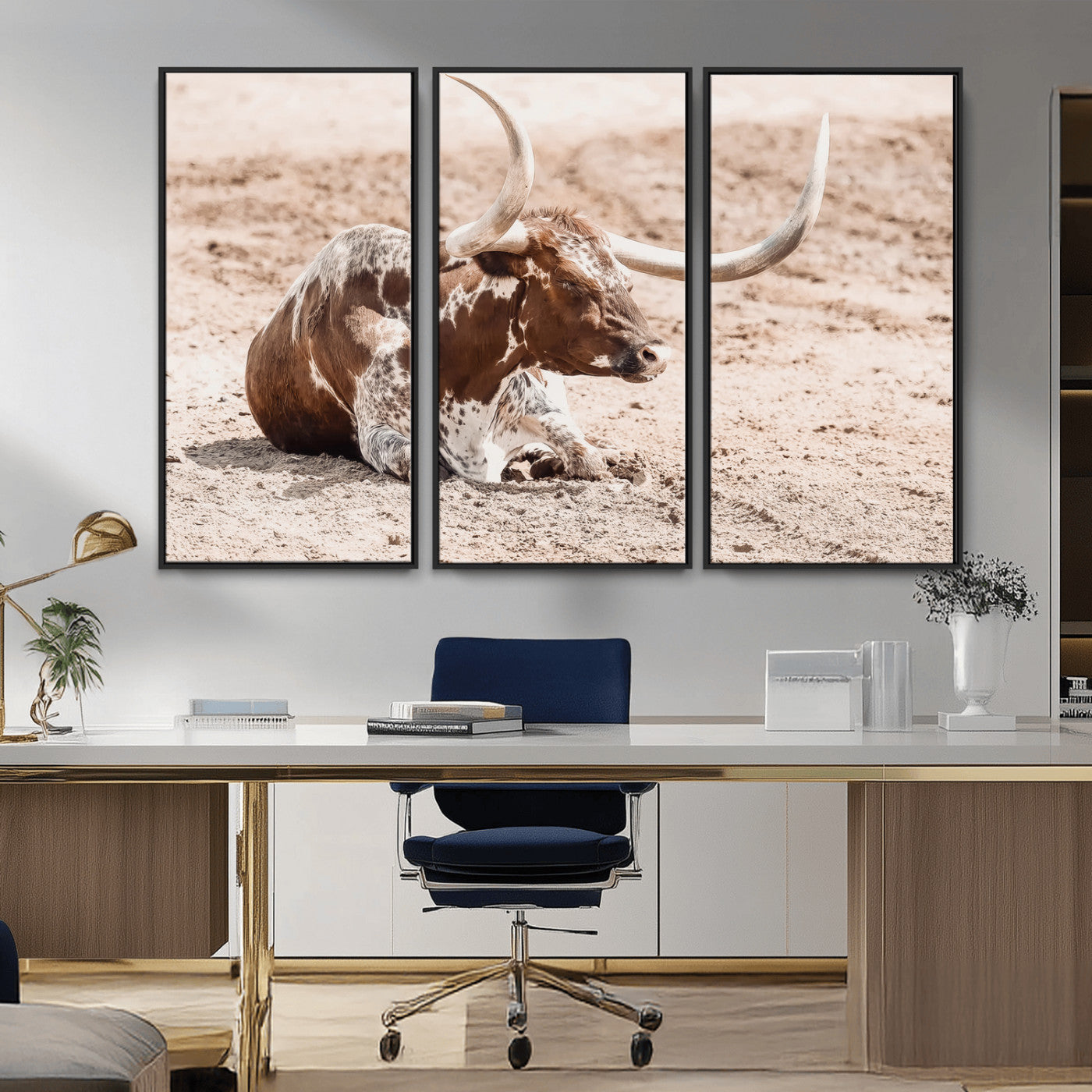 Texas Longhorn bull resting on dusty ground with warm tones, ideal for rustic western or farmhouse-themed wall decor.