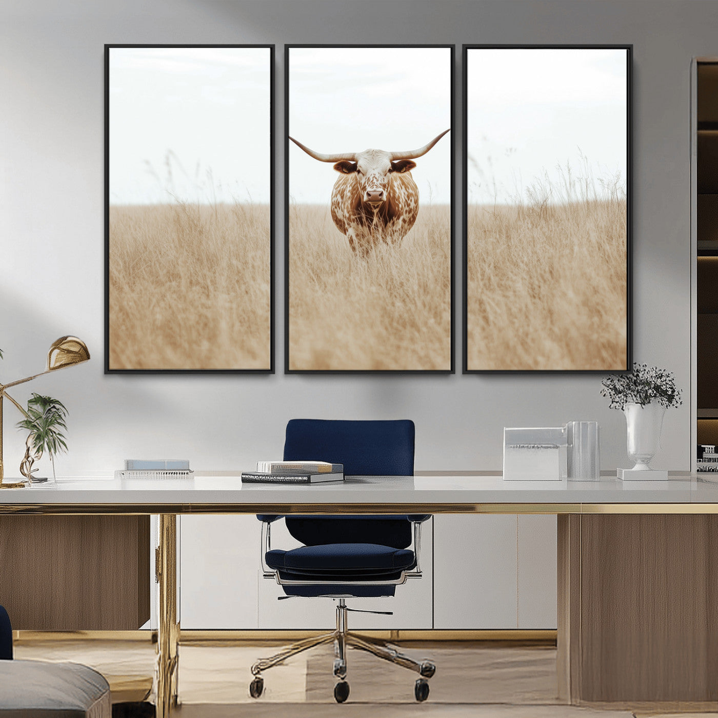 Texas Longhorn bull standing alone in dry grass with neutral tones, ideal for rustic western or cowboy-themed wall decor.