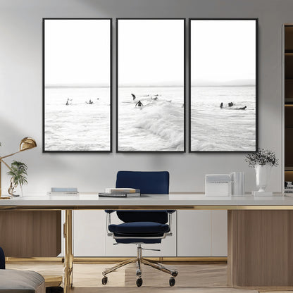 Monochrome photo of surfers riding and waiting on ocean waves, ideal for surf-themed or coastal energy wall decor.