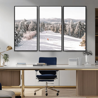 Bright ski trail lined with snow-covered pines and a skier in orange, perfect for alpine adventure or winter sports-inspired decor.