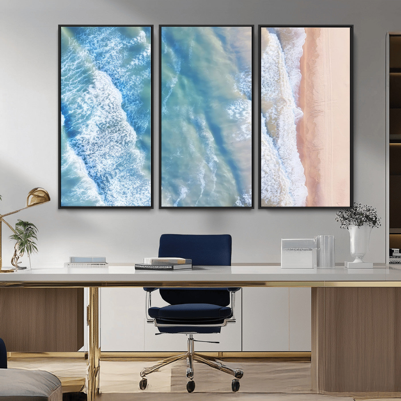 Aerial photo of soft blue waves meeting sandy shore, perfect for modern coastal or beach-themed decor with a light and tranquil aesthetic.