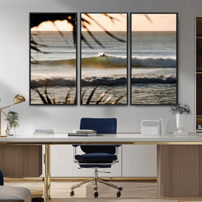 Photo of a surfer riding a golden hour wave at sunset, with tropical tones and dreamy light, perfect for tropical boho or coastal home decor.