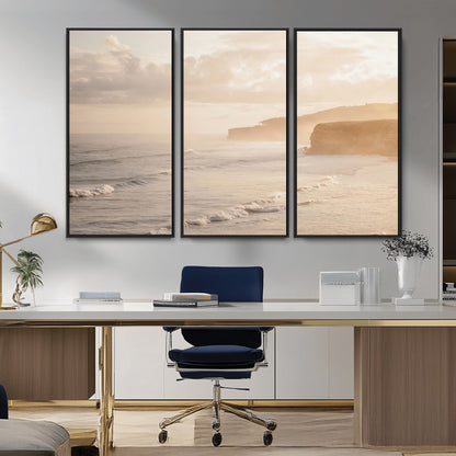 Golden hour seascape with misty cliffs and gentle waves rolling towards the shore, capturing a tranquil and warm coastal atmosphere.