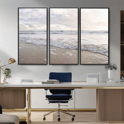 Peaceful ocean waves rolling onto the sandy shore under soft light, perfect for neutral or coastal minimalist decor themes.