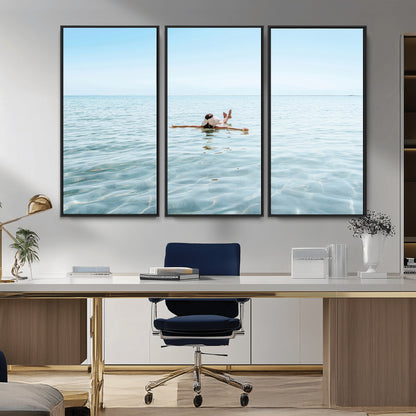 A peaceful minimalist scene of a person floating on crystal-clear water, surrounded by a vast open horizon, capturing relaxation and serenity in a tranquil aquatic setting.
