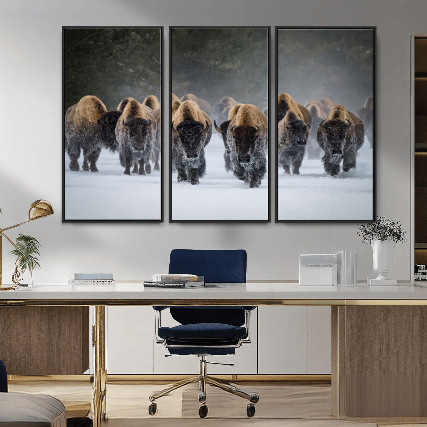 A herd of American bisons walking through deep snow in a forest, evoking a powerful rustic wilderness mood for western-style interiors.