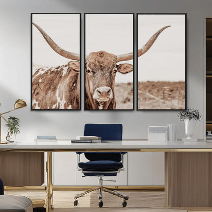 A longhorn cow in soft beige desert tones, standing calmly in open land, perfect for neutral western or rustic farmhouse interiors.