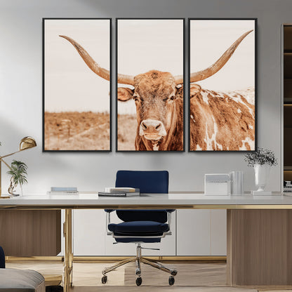 A longhorn bull standing proudly in a sunlit desert field with warm neutral tones, ideal for rustic western or farmhouse interiors.