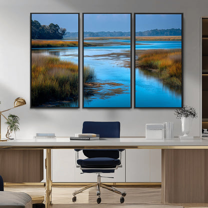A peaceful marshland scene with calm blue water reflecting the surrounding grasses and trees, capturing the beauty of nature in a serene landscape.