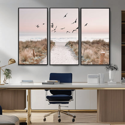 A peaceful coastal pathway leading to the ocean, with birds flying across a soft pastel sky, creating a calm and scenic beach atmosphere.