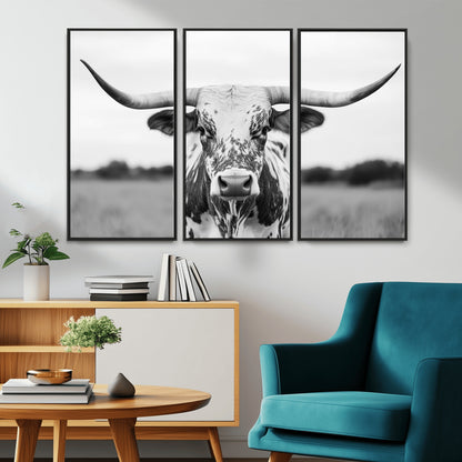 Capture the strength and elegance of nature with this striking black and white portrait of a longhorn cow. Its powerful presence makes a bold statement in any room.