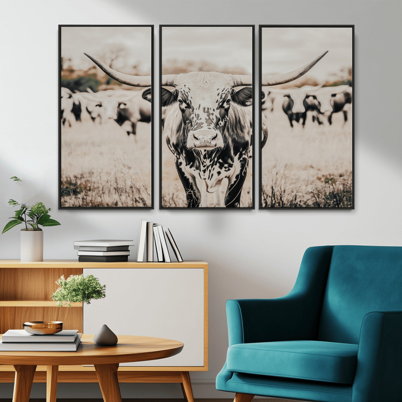 Canvas of a speckled Texas longhorn standing boldly in a field with a herd behind, perfect for rustic western or farmhouse wall decor.