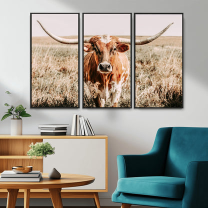 Framed longhorn cow canvas wall art with rustic prairie background, western animal print perfect for farmhouse or ranch style decor
