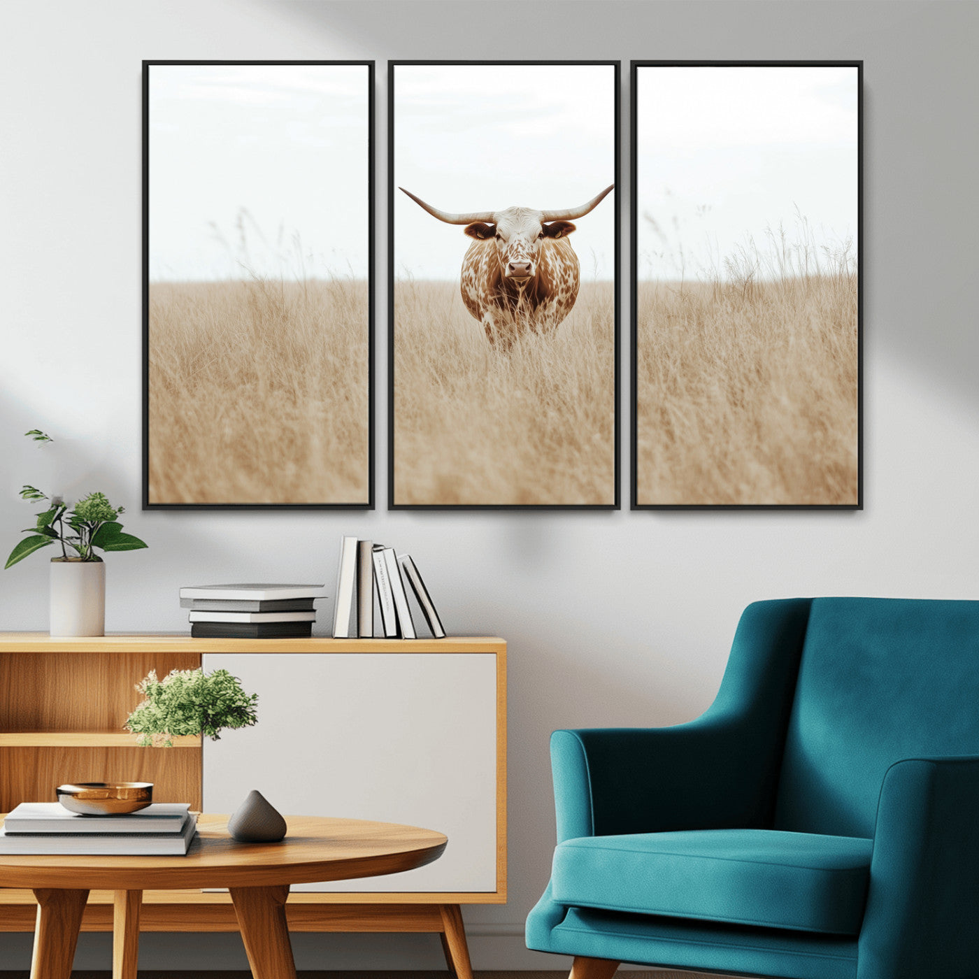 Texas Longhorn bull standing alone in dry grass with neutral tones, ideal for rustic western or cowboy-themed wall decor.