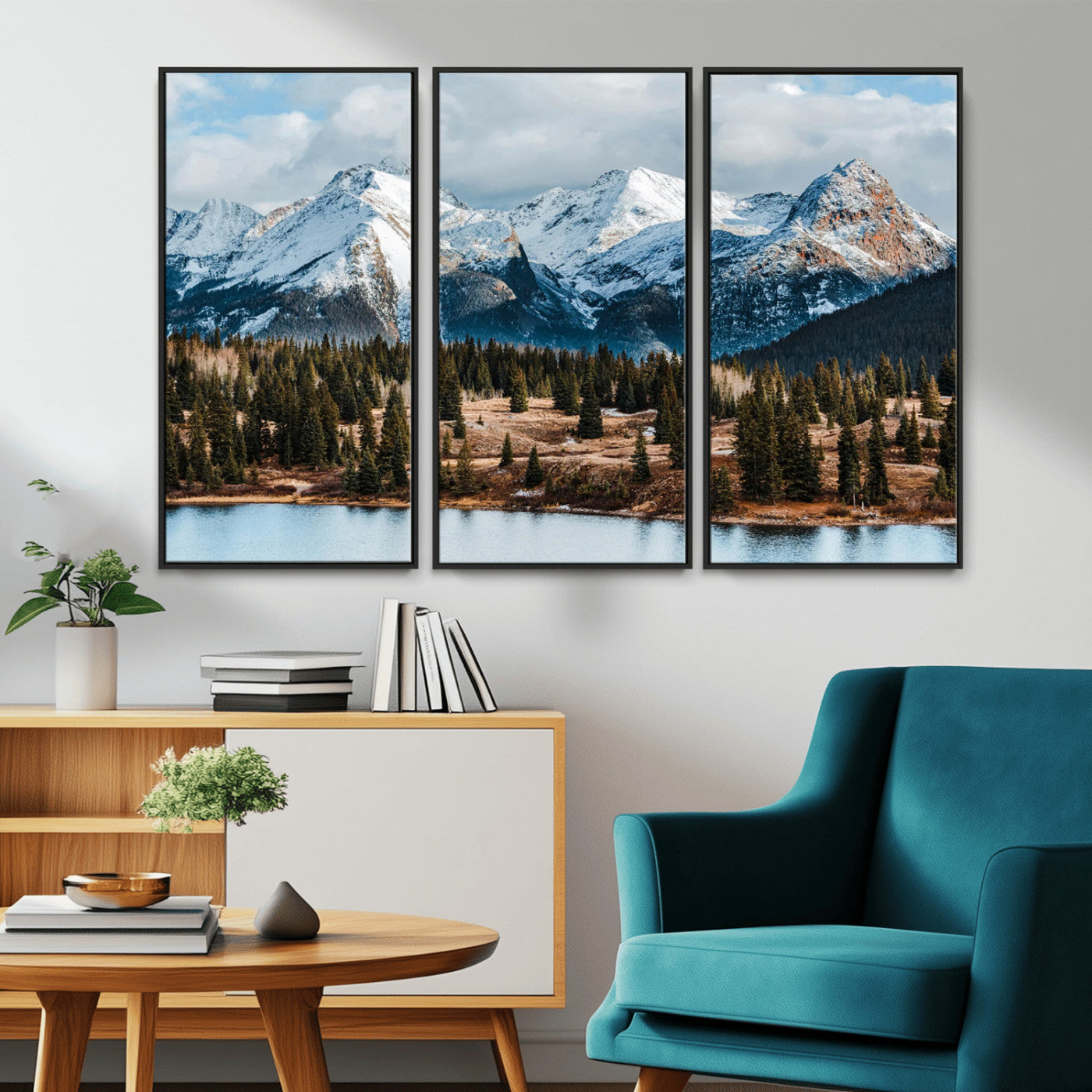 Framed canvas of snowy mountain peaks with pine forest and alpine lake, perfect for winter cabin or wilderness-inspired home decor.