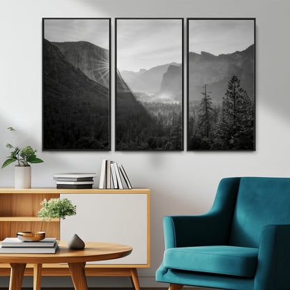 Black and white landscape of Yosemite with sun rays peeking over El Capitan, ideal for moody nature or modern rustic decor.