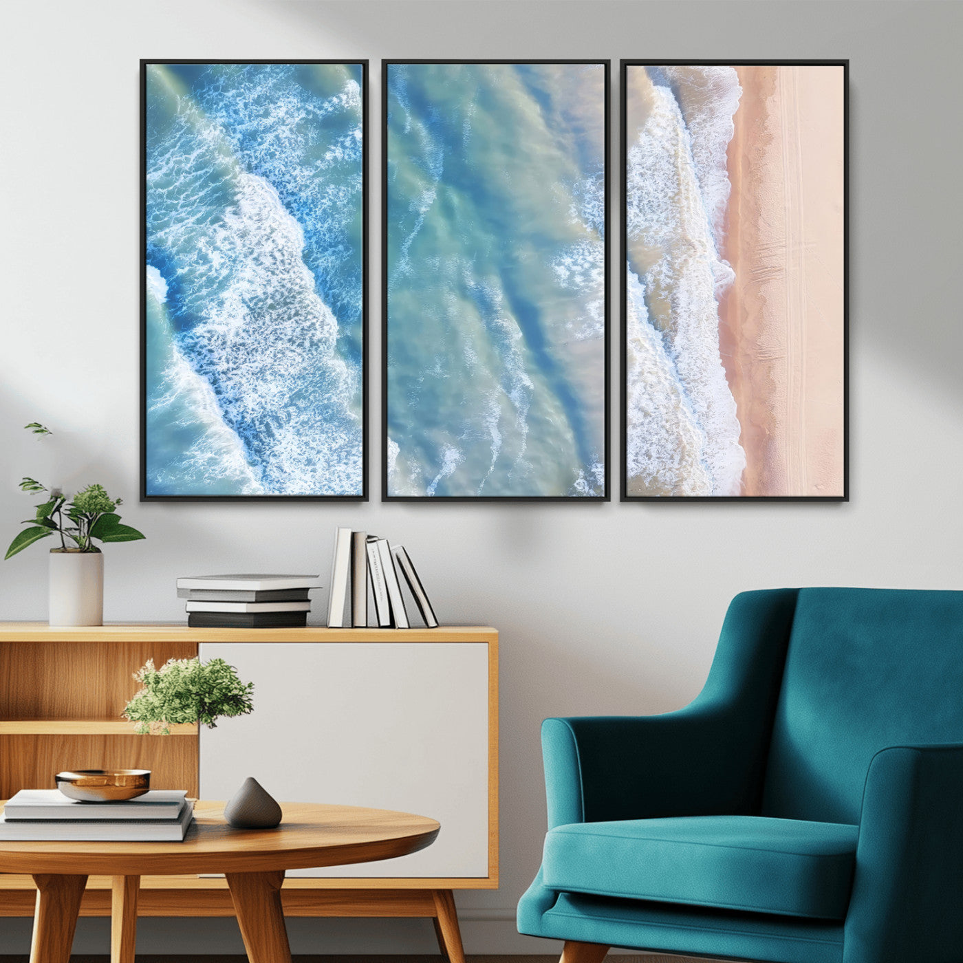 Aerial photo of soft blue waves meeting sandy shore, perfect for modern coastal or beach-themed decor with a light and tranquil aesthetic.