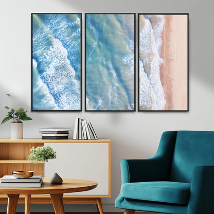 Aerial photo of soft blue waves meeting sandy shore, perfect for modern coastal or beach-themed decor with a light and tranquil aesthetic.