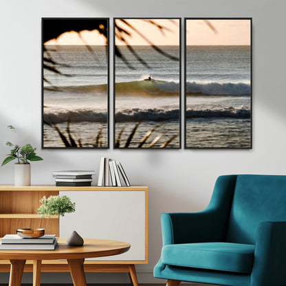 Photo of a surfer riding a golden hour wave at sunset, with tropical tones and dreamy light, perfect for tropical boho or coastal home decor.