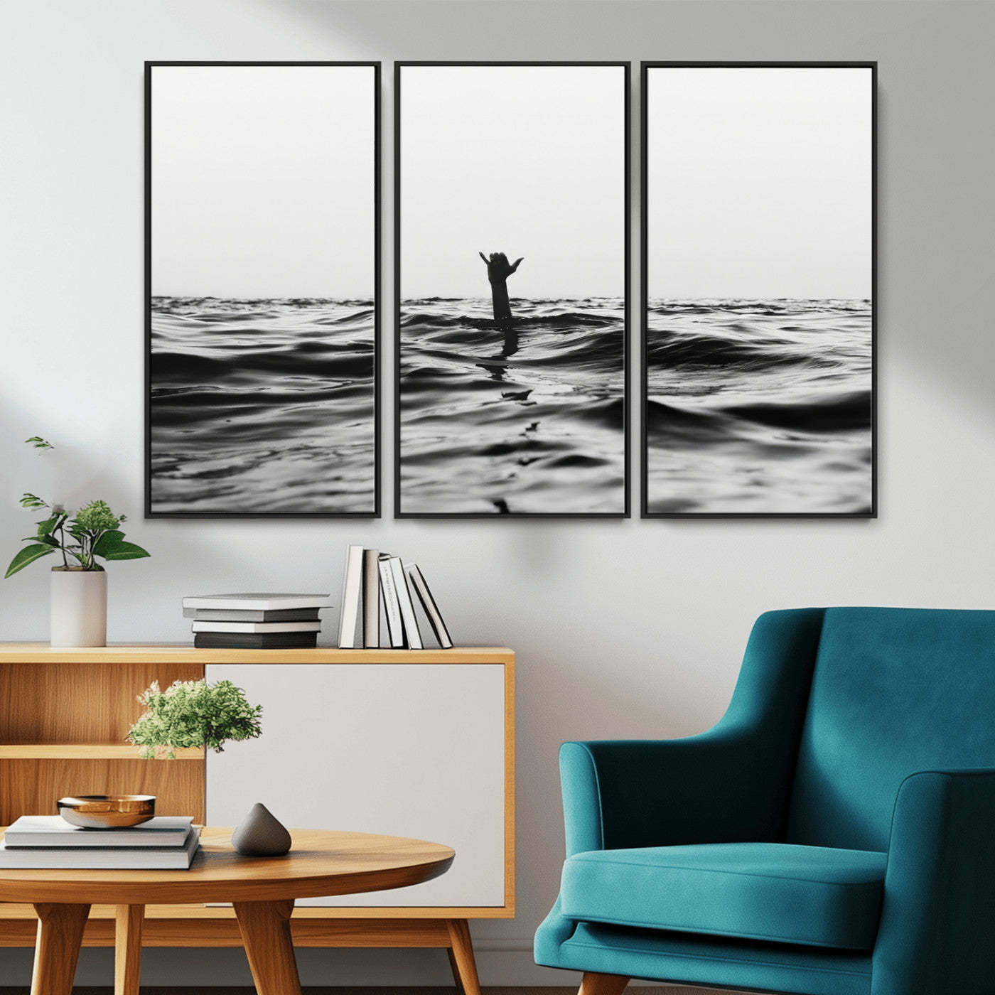 Black and white ocean with a hand making a surfer sign among dark waves, creating a dramatic and minimalist seascape with bold contrast.