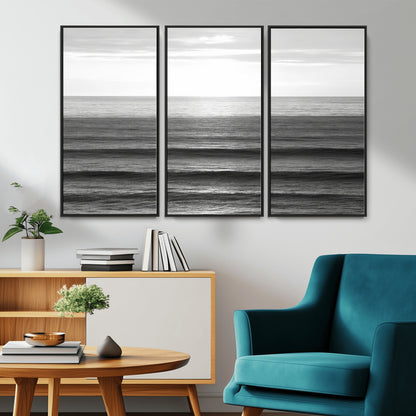Minimalist black and white ocean view with layered waves reflecting sunlight, evoking a sense of calm and coastal serenity.