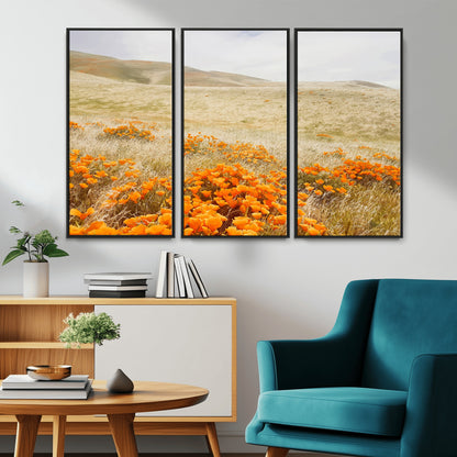 A golden field with vibrant orange poppies blooming across rolling hills under a soft, sunlit sky, creating a warm and rustic landscape.