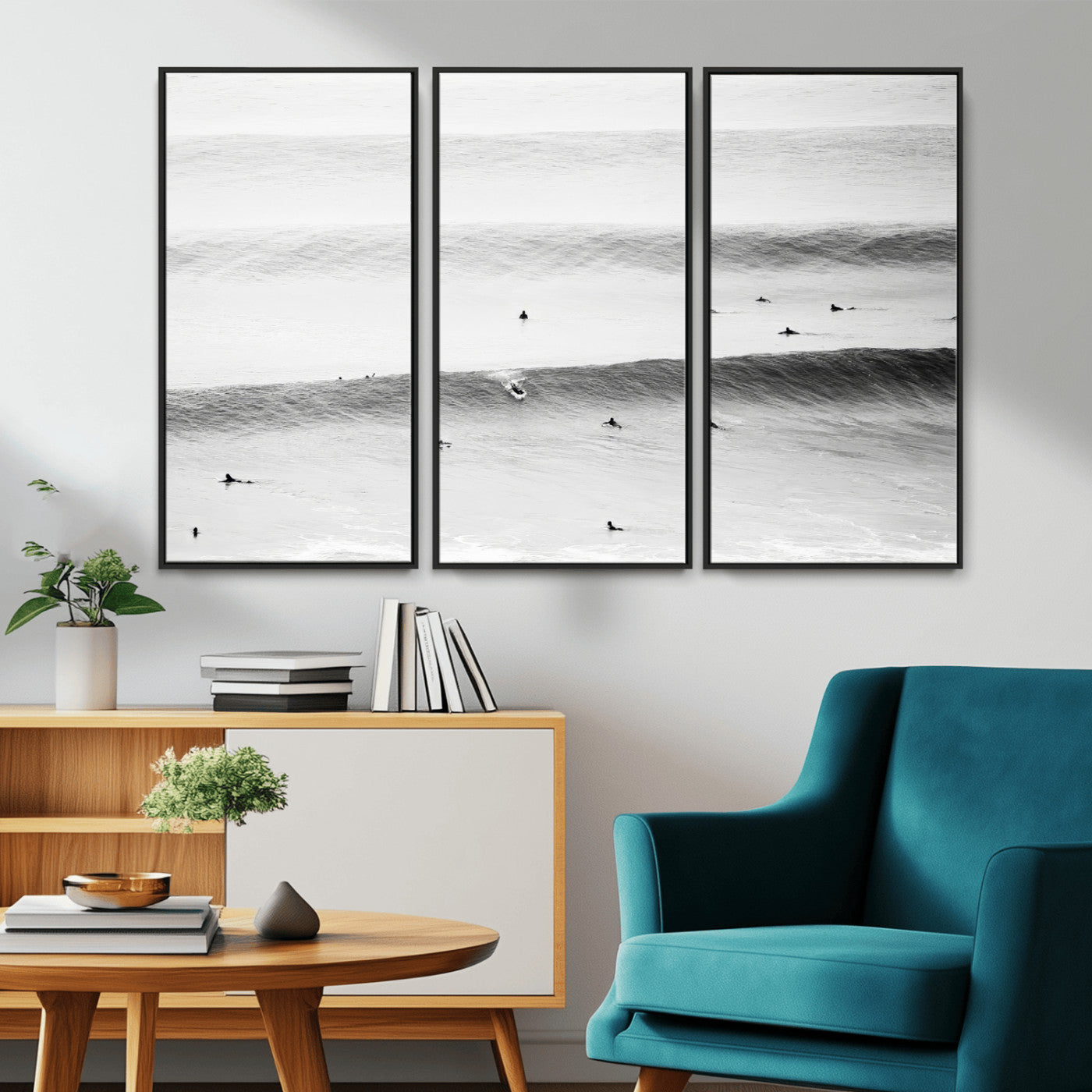 A monochrome photograph of swimmers gliding through gentle ocean waves, evoking a sense of calm and movement.