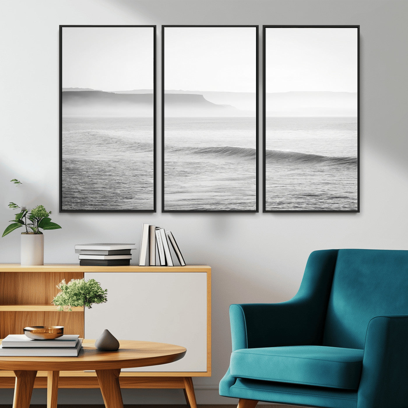 A black and white minimalist seascape featuring soft rolling waves and misty distant cliffs, creating a serene and timeless coastal atmosphere.
