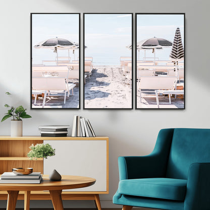 A serene minimalist beach scene featuring striped umbrellas, soft pastel sand, and an elegant lounge setup, creating a tranquil and stylish coastal retreat.