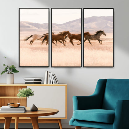 A herd of wild horses galloping through a sunlit desert plain with mountains in the background, perfect for rustic or western-themed wall decor.