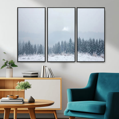 Snow-covered forest under misty sky, soft light breaking through clouds, ideal for minimalist or Nordic-inspired home decor.