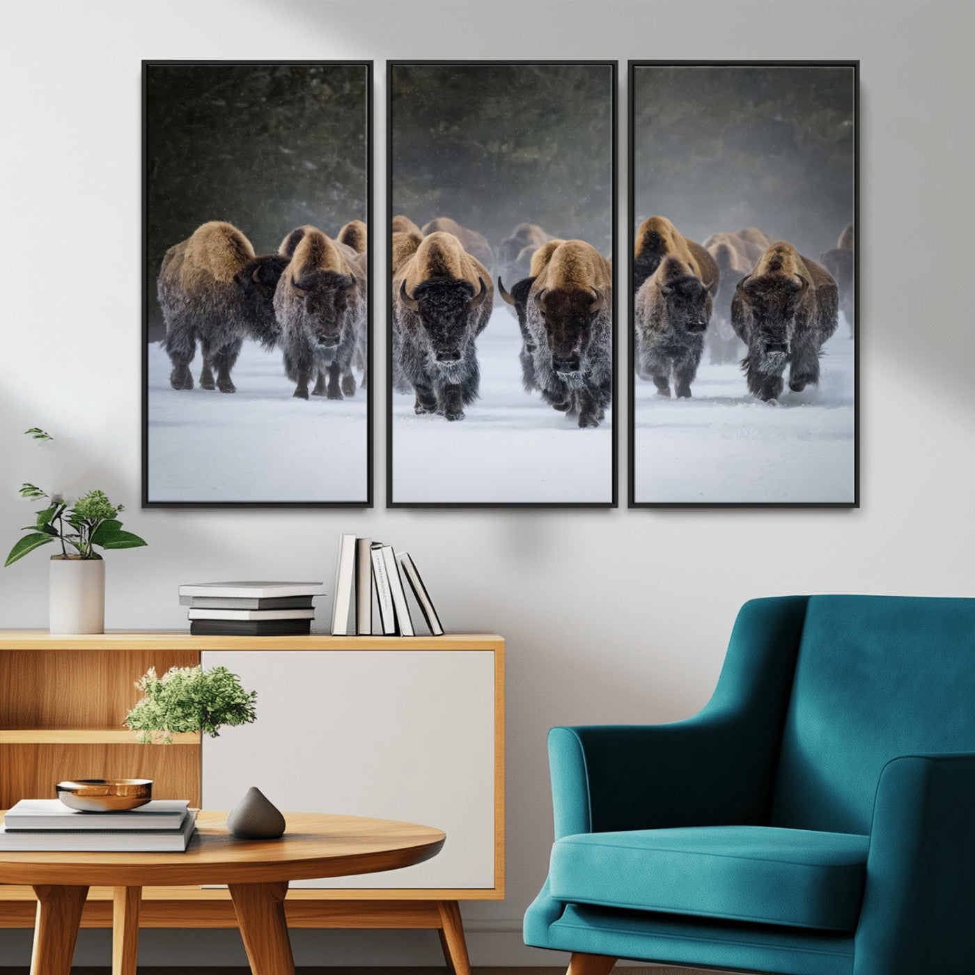 A herd of American bisons walking through deep snow in a forest, evoking a powerful rustic wilderness mood for western-style interiors.