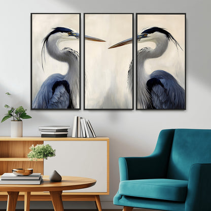 Two blue herons facing each other on a soft neutral background, ideal for coastal, tranquil, or nature-inspired minimalist interiors.