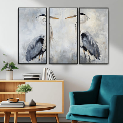Two herons facing each other on a soft-toned background with blue-grey feathers, perfect for tranquil, coastal or nature-themed interiors.