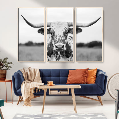 Capture the strength and elegance of nature with this striking black and white portrait of a longhorn cow. Its powerful presence makes a bold statement in any room.