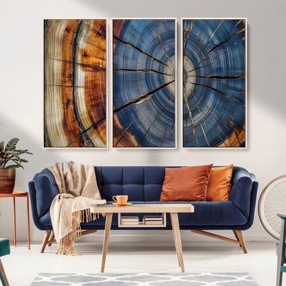 A stunning close-up view of a tree trunk, showcasing the intricate growth rings in a vibrant mix of warm browns, cool blues, and hints of natural texture.