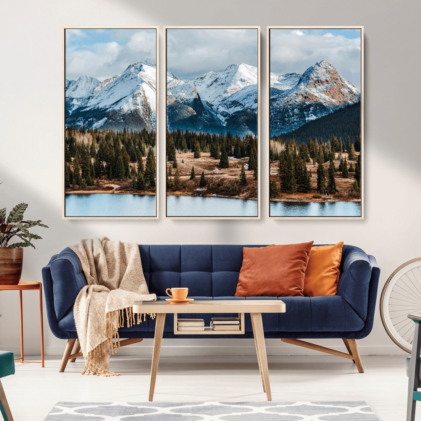 Framed canvas of snowy mountain peaks with pine forest and alpine lake, perfect for winter cabin or wilderness-inspired home decor.