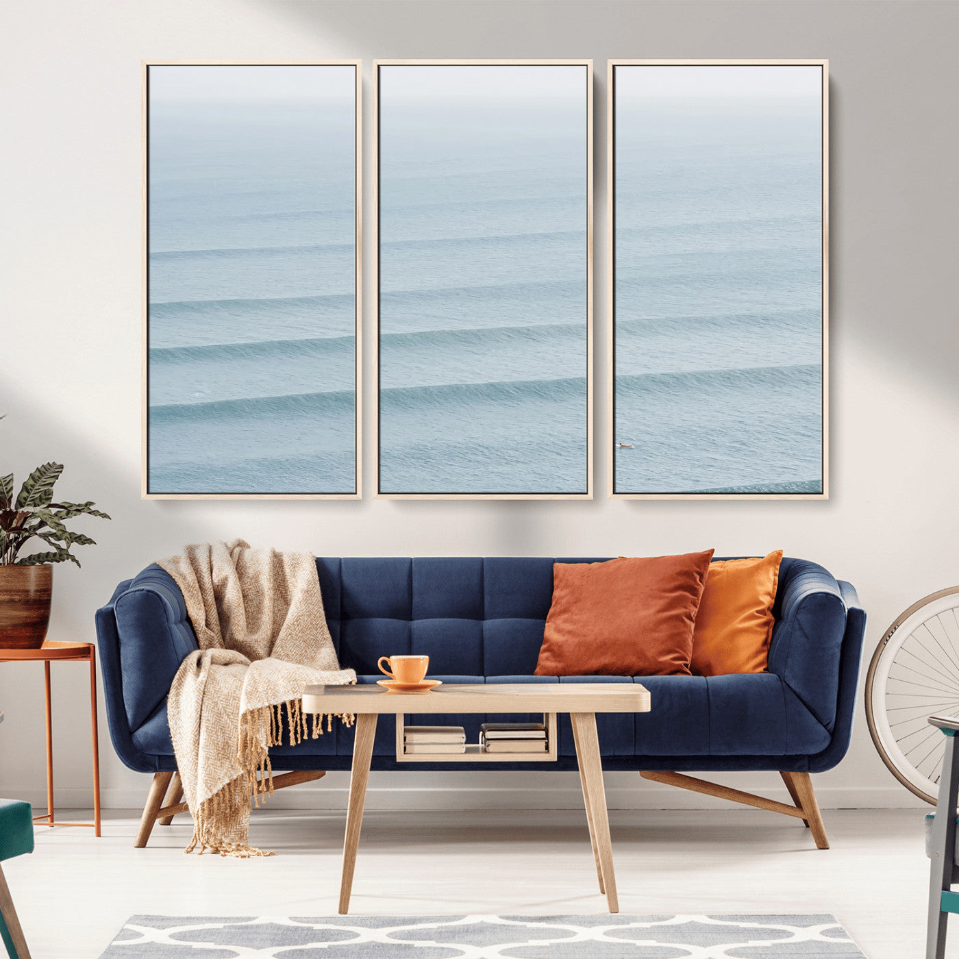 Framed canvas of repeating ocean waves with a distant solo surfer, ideal for minimalist ocean or calm coastal wall decor.