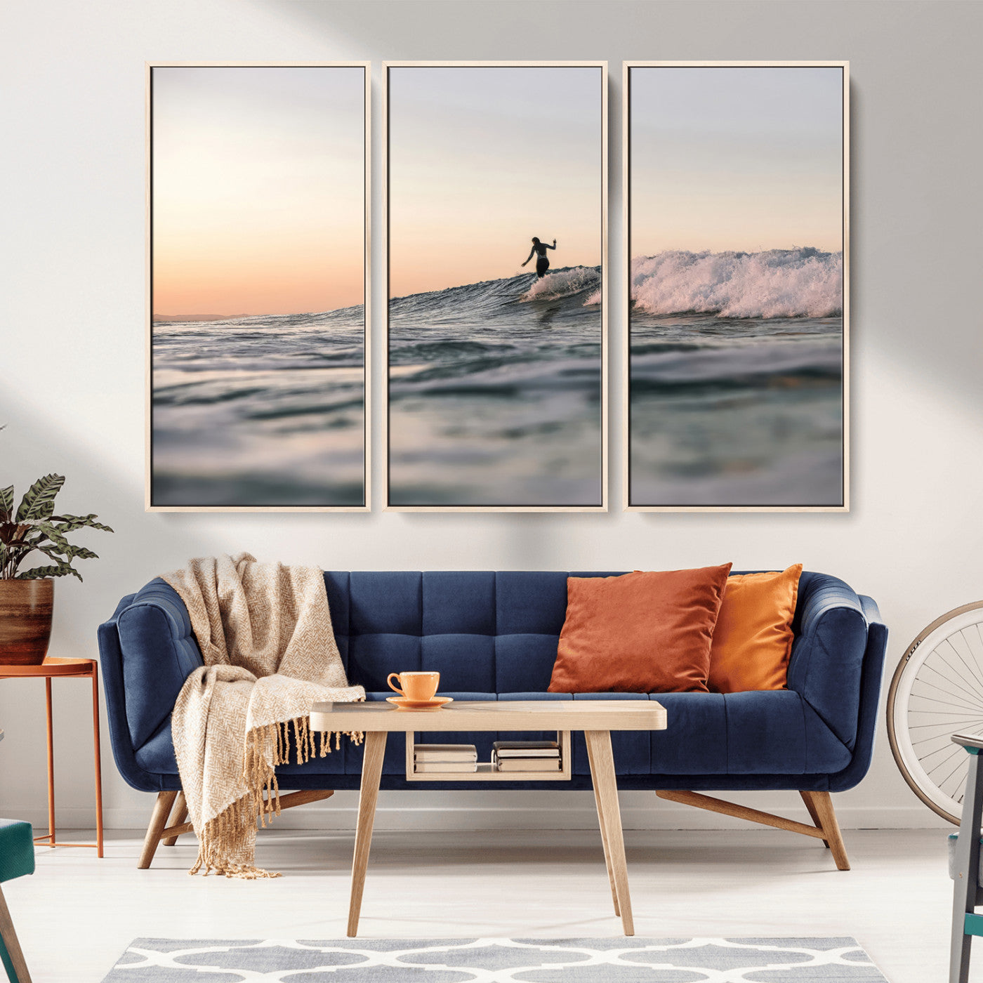 Framed canvas of a female surfer balancing on a wave at sunset, perfect for serene surf or ocean-inspired coastal decor.